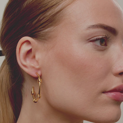 Pendientes tipo brazalete de alambre de púas con borde